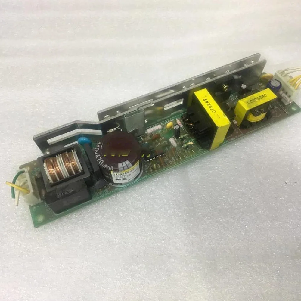Open-frame switching power supply unit, green PCB with components visible