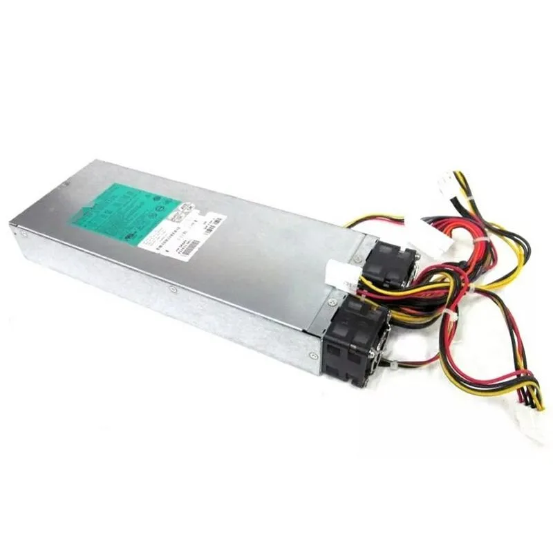 Rectangular silver metal ATX power supply unit with fan grille and power connectors