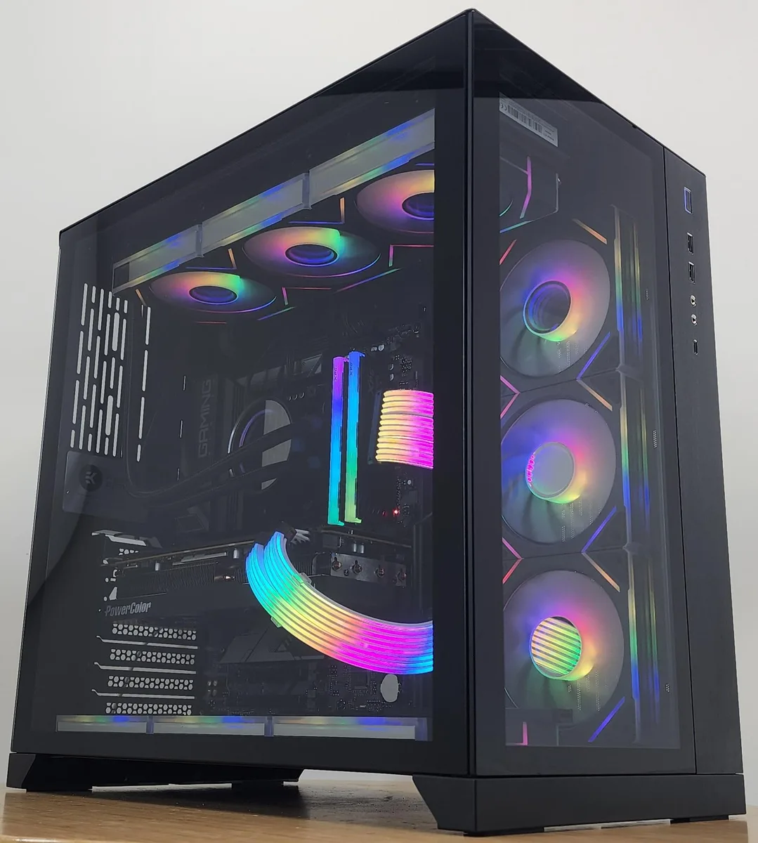 Black Lian Li O11 Dynamic ATX case with 360mm RGB AIO cooler visible through glass panel