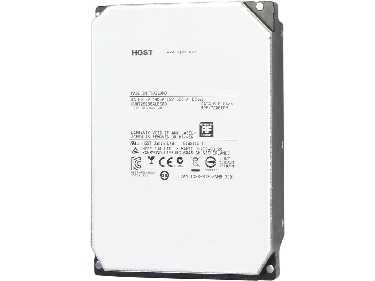 Silver 3.5 inch bare hard drive with exposed circuit board