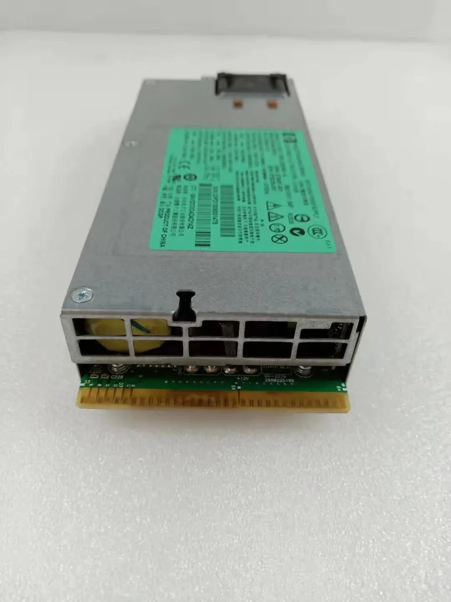 Rectangular silver server PSU with rear fan grille and power socket