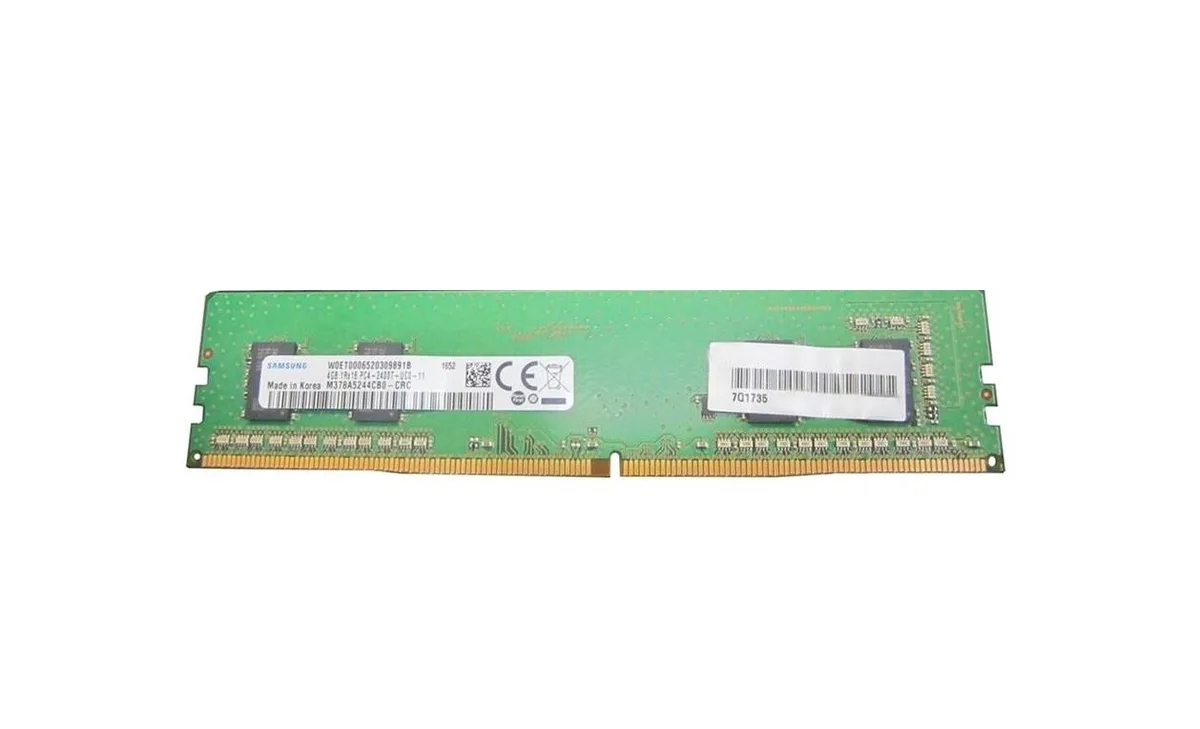 Green rectangular circuit board with black memory chips and gold edge connectors