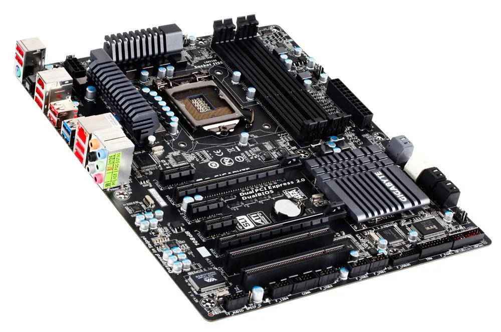 Rectangular ATX motherboard with black PCB, silver heatsinks, blue PCIe slots, and silver I/O shield