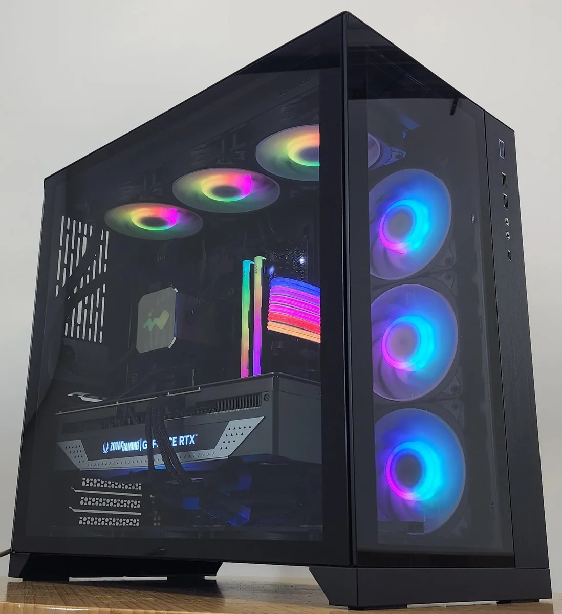 Black Lian Li O11 Dynamic ATX case with 360mm AIO RGB cooler visible through tempered glass side panel