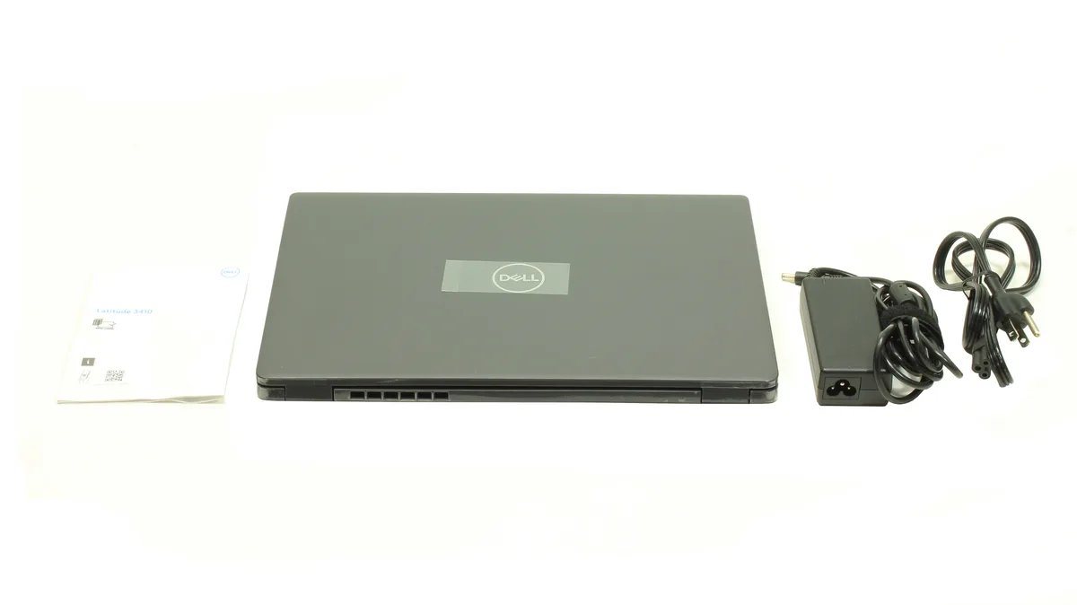 Silver 14 inch laptop closed on flat surface