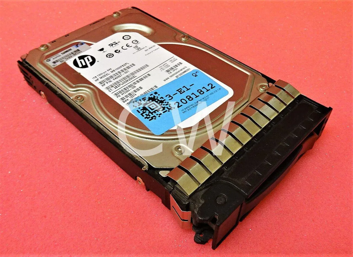 Silver 3.5 inch hard drive mounted in a black HP Smart Carrier caddy with a green release latch
