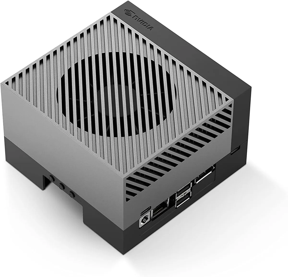 Compact silver development board with large heatsink, multiple ports and attached module