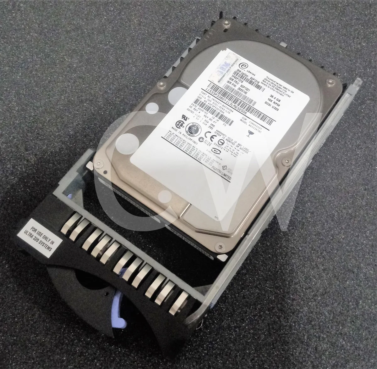 Silver 3.5 inch hard drive with black caddy tray and 80 pin SCSI connector