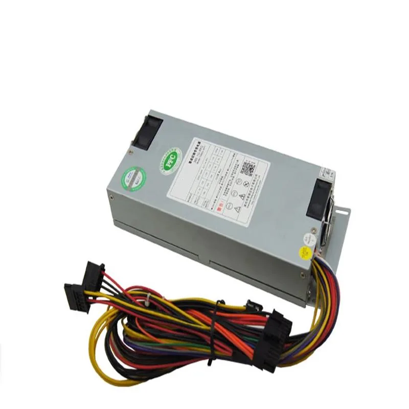Compact 1U silver ATX power supply with fan grille and cable bundle