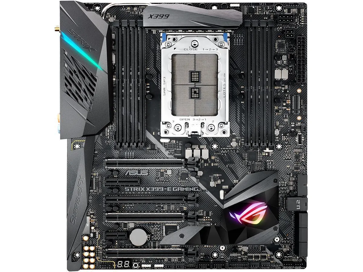 Extended ATX motherboard in dark finish with RGB lighting and TR4 socket area visible