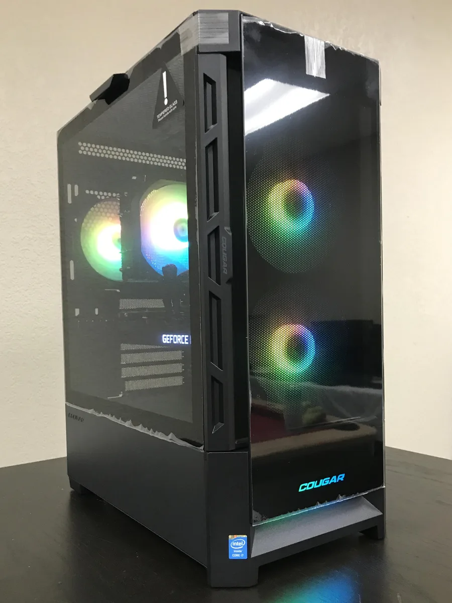Black mid-tower gaming desktop with ARGB CPU cooler visible through side panel