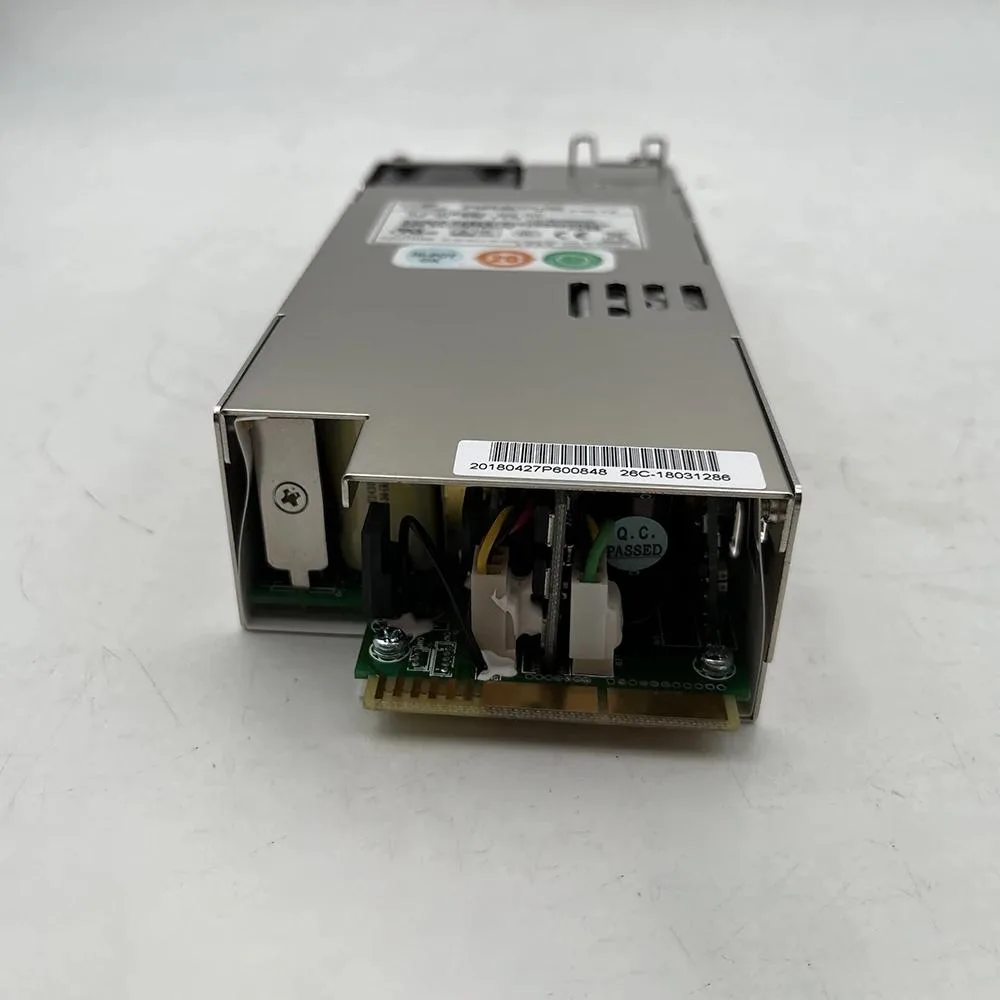 Silver rectangular server power supply unit with rear fan grille and power connector