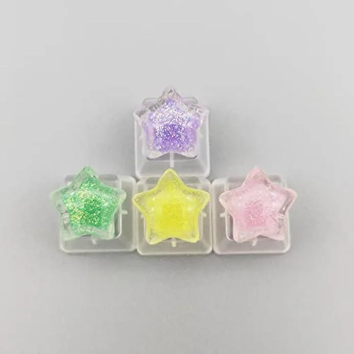 Four colourful star-shaped keycaps with glossy finish