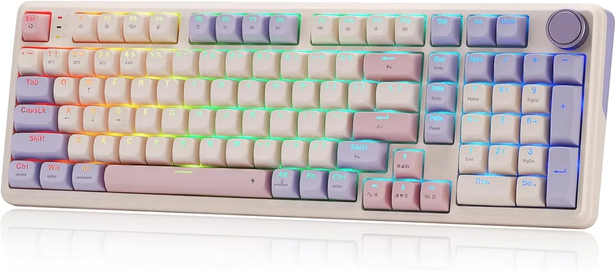Black full-size mechanical keyboard with a metal control knob and RGB backlighting