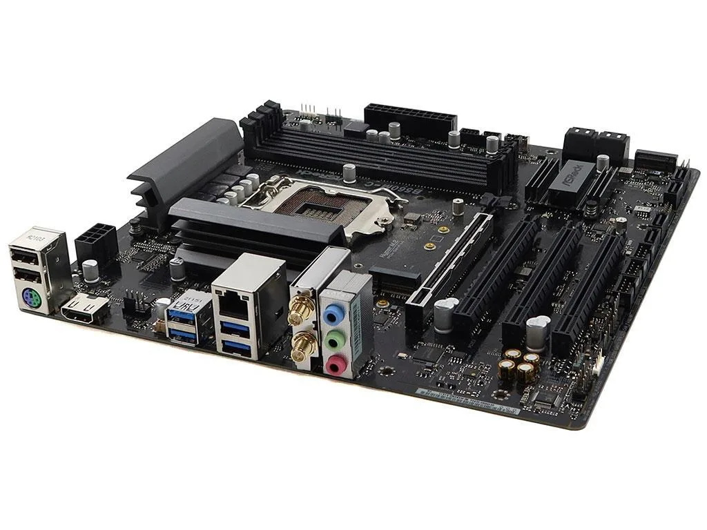 Green micro-ATX motherboard with black sockets and silver heatsinks