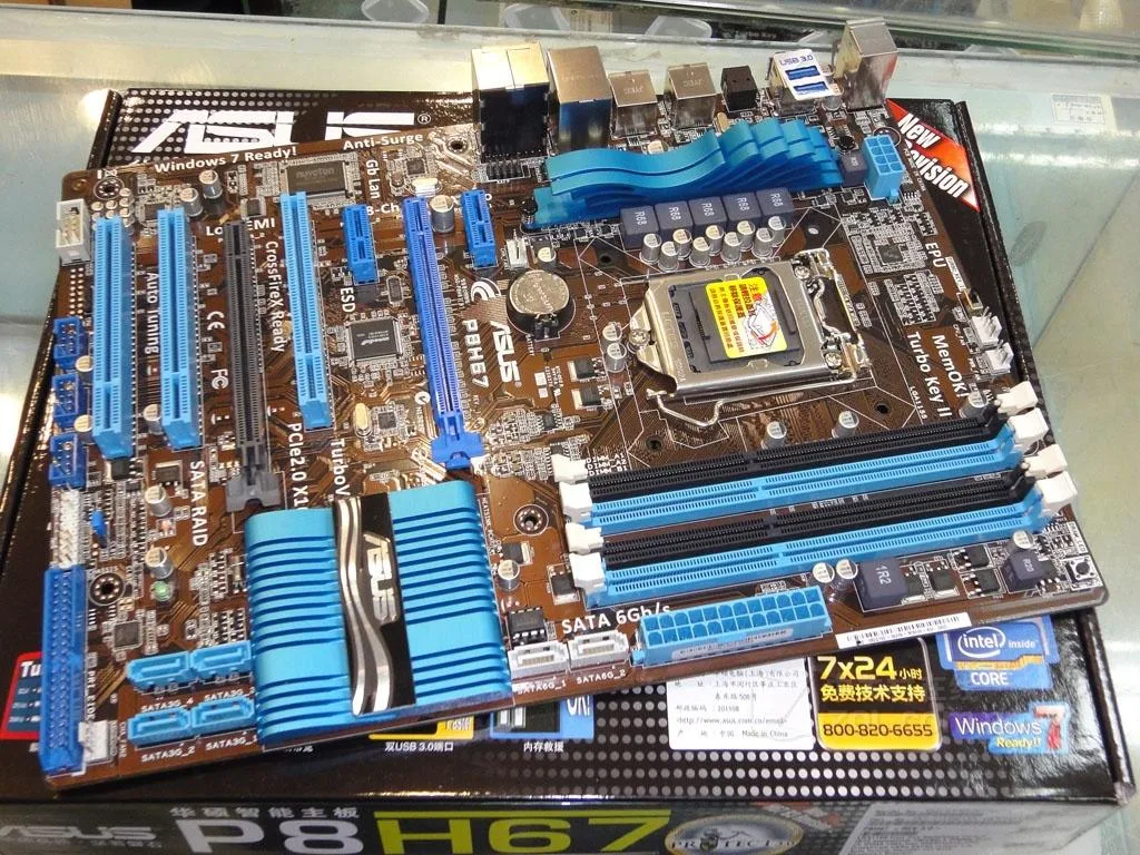 ASUS P8H67 ATX motherboard with LGA 1155 socket and DDR3 slots