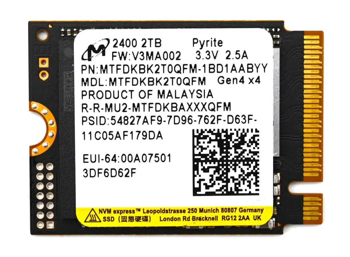 Small black M.2 2230 circuit board with gold edge connector and label