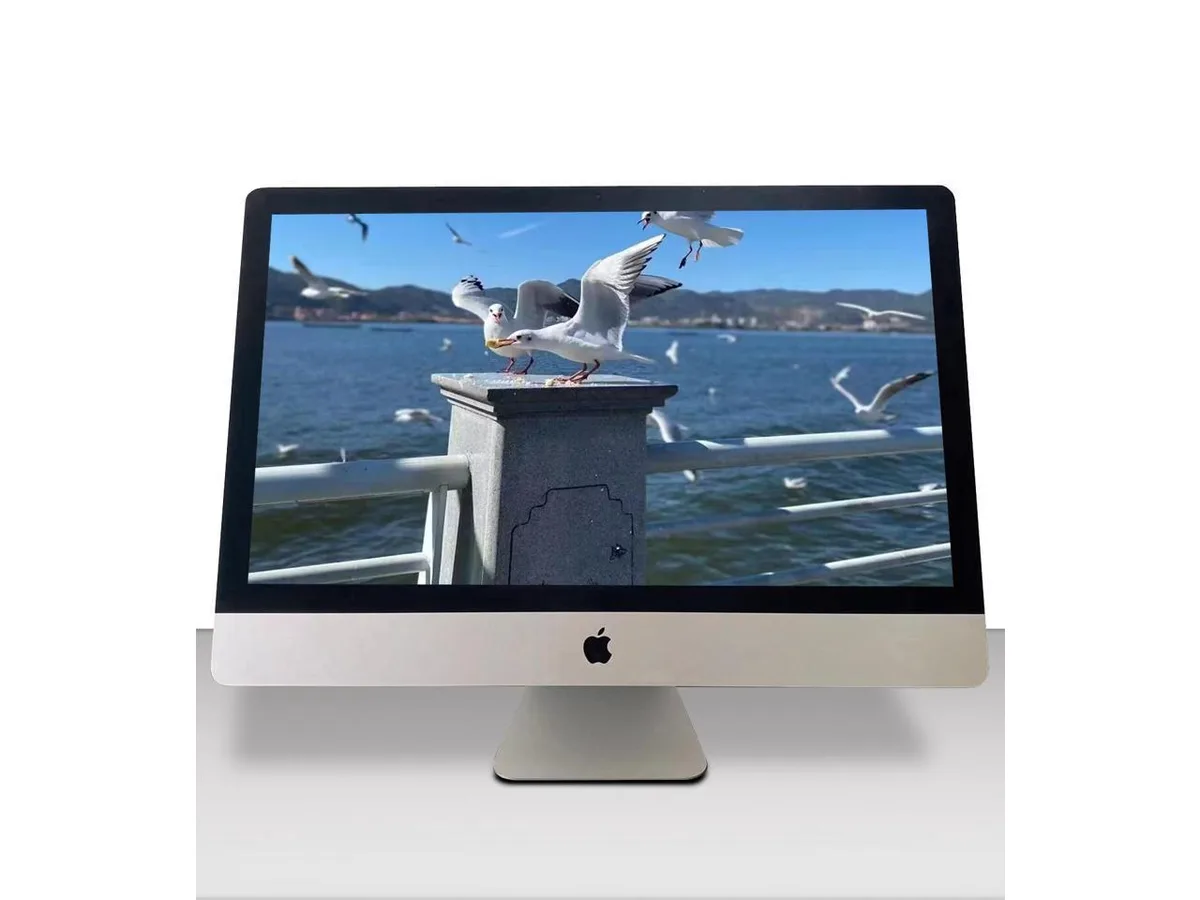 Silver aluminium all-in-one desktop with 27 inch Retina 5K display keyboard and mouse included