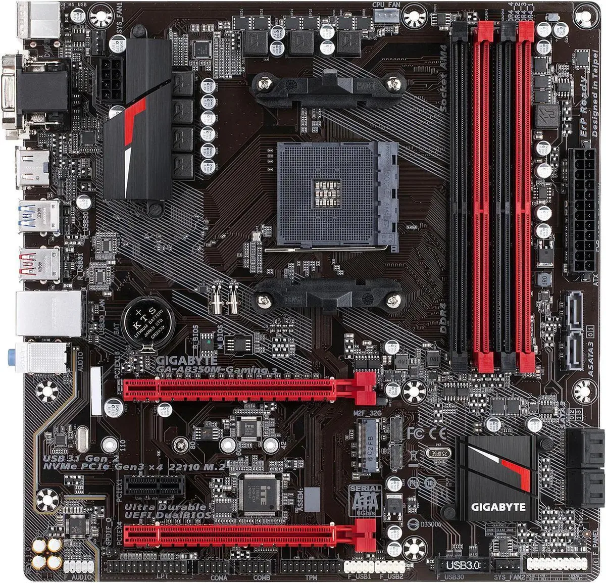 Micro ATX motherboard with black PCB, silver heatsinks and rear I/O shield