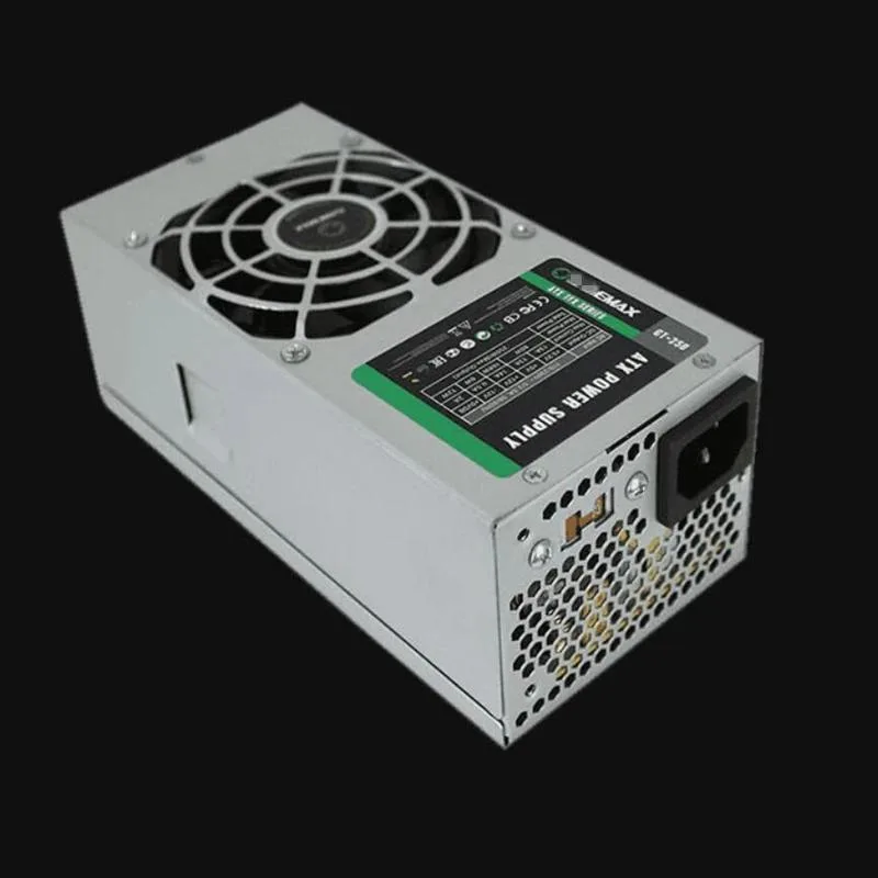 Small rectangular metal power supply unit with fan grille and cable bundle