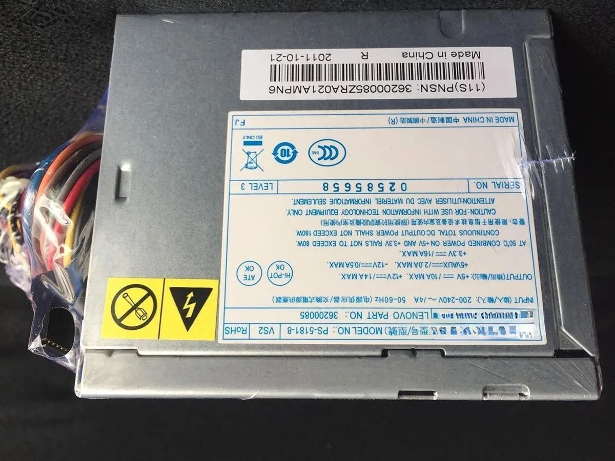 Silver rectangular ATX power supply unit with ventilation grille and power socket