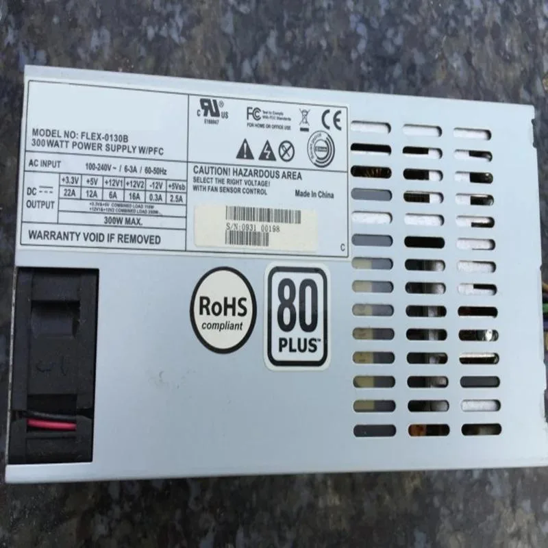 Rectangular ATX power supply unit with matte black metal casing and cooling fan grille