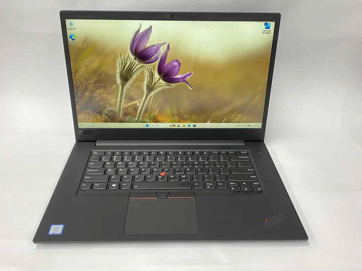Black Lenovo ThinkPad P1 laptop, 15.6 inch non-touch screen, slim chassis, matte finish, charger included