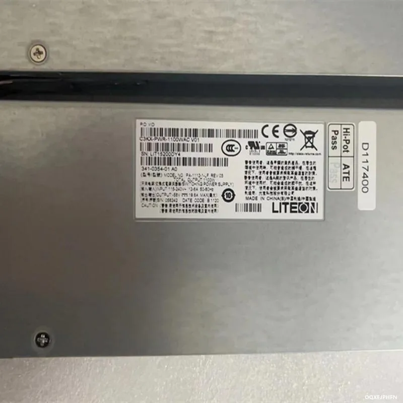 Silver rectangular ATX power supply unit with ventilation grille and label showing 1100W