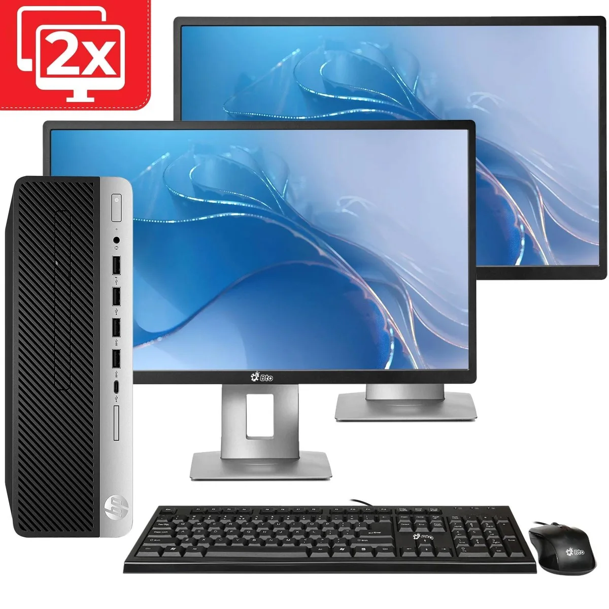 Compact black small-form-factor desktop with dual 24-inch monitors, keyboard and mouse