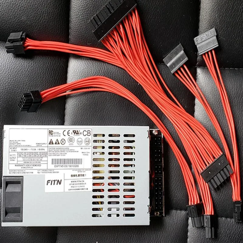 Rectangular metal ATX power supply unit with fan grille and model label