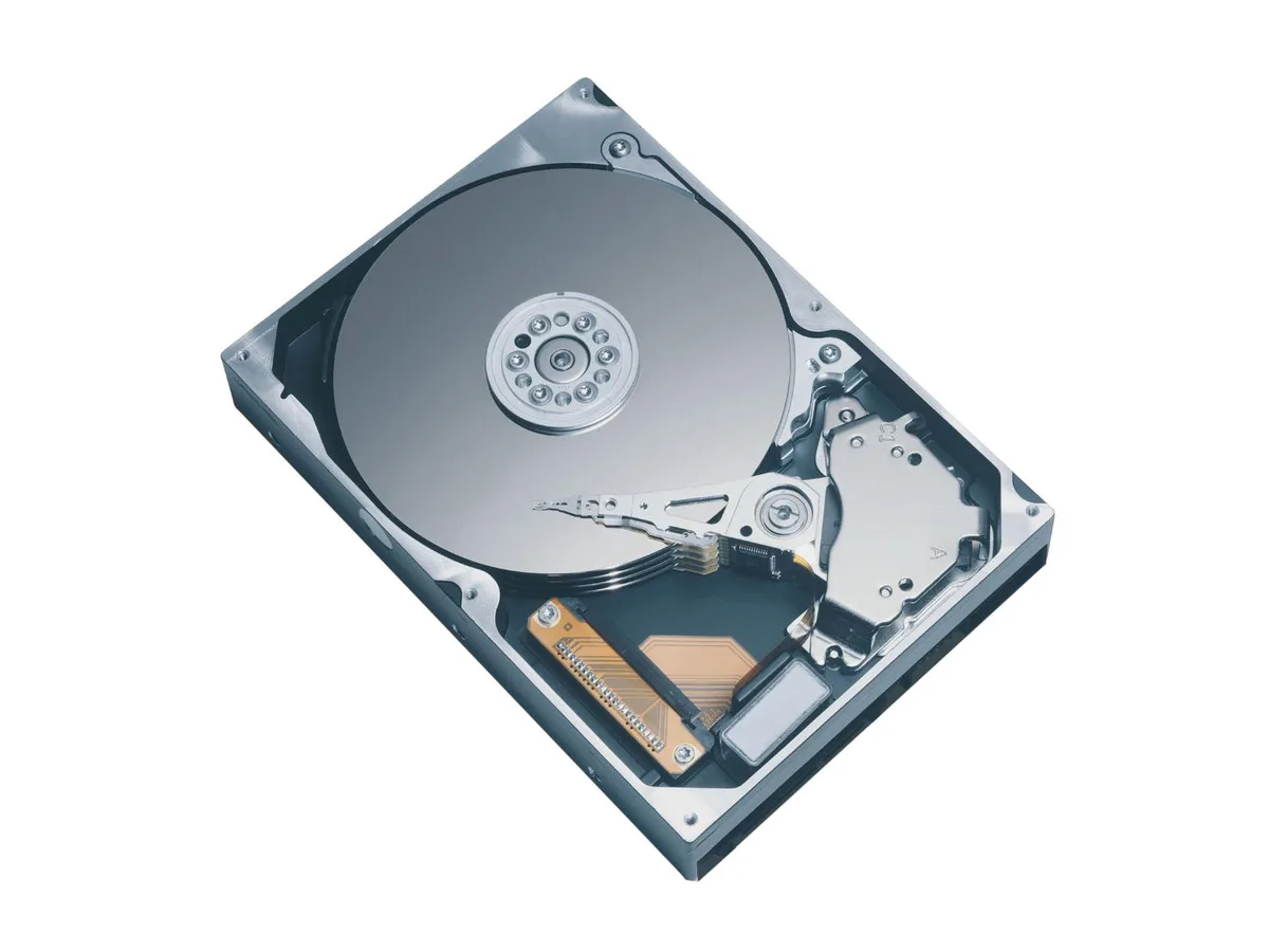 Silver 3.5 inch bare hard drive with green circuit board visible