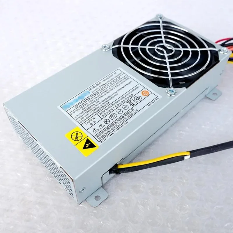 Compact silver ATX power supply unit with rear fan grille and cable bundle