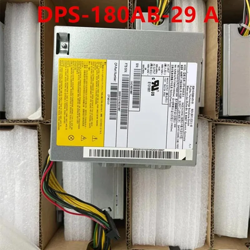 Compact ATX power supply unit in matte black metal casing with rear fan grille and side label