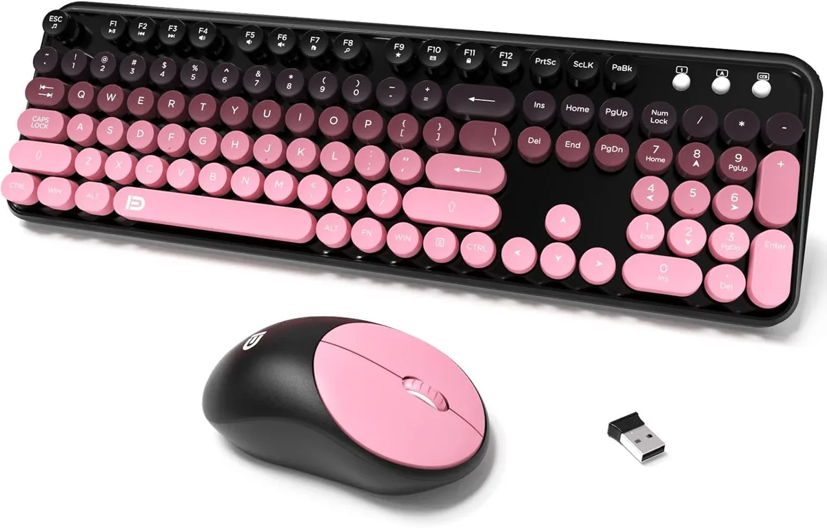 Pink full-size wireless keyboard with round keycaps and matching mini mouse