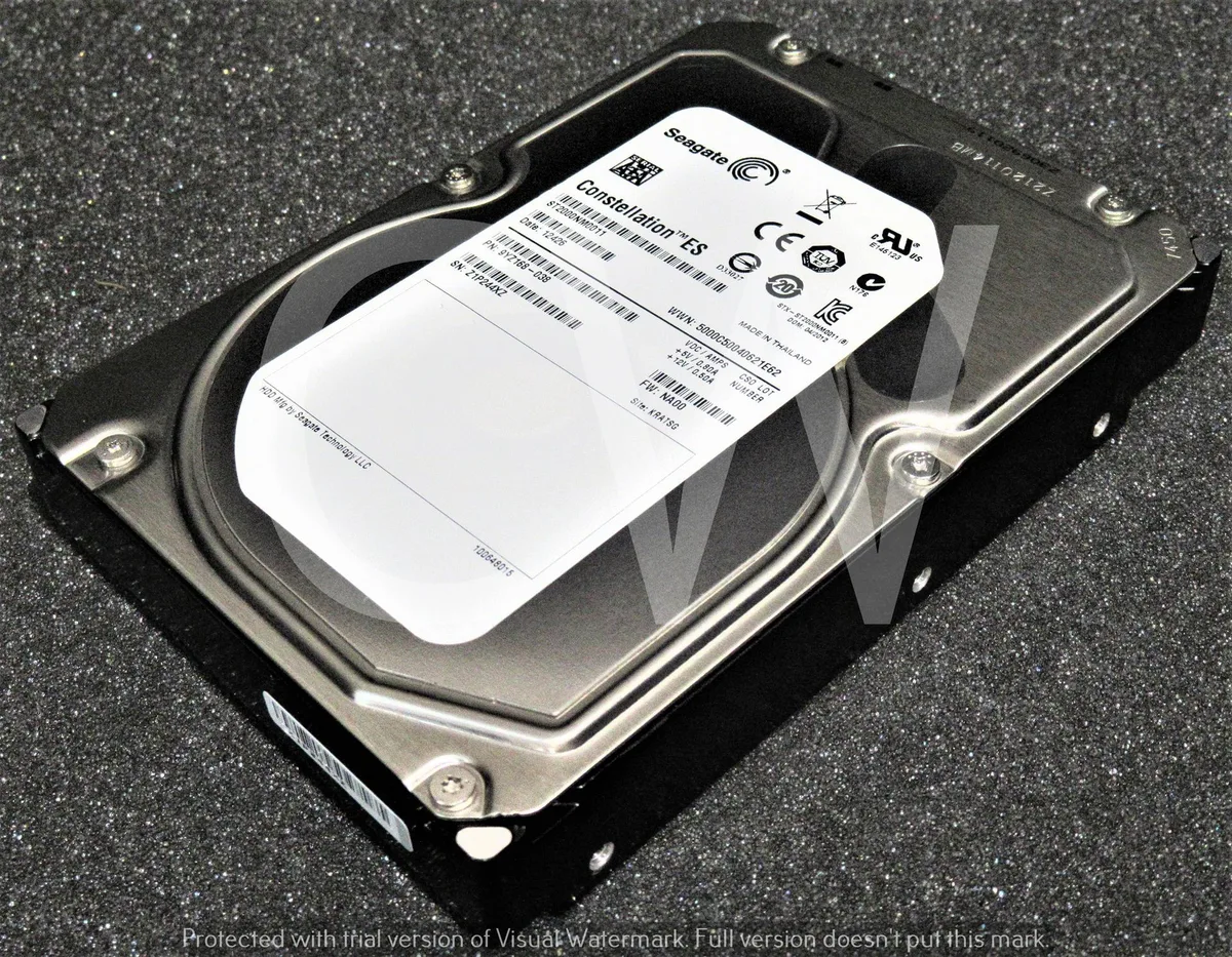 Silver rectangular 3.5 inch SATA hard drive with circuit board visible underneath