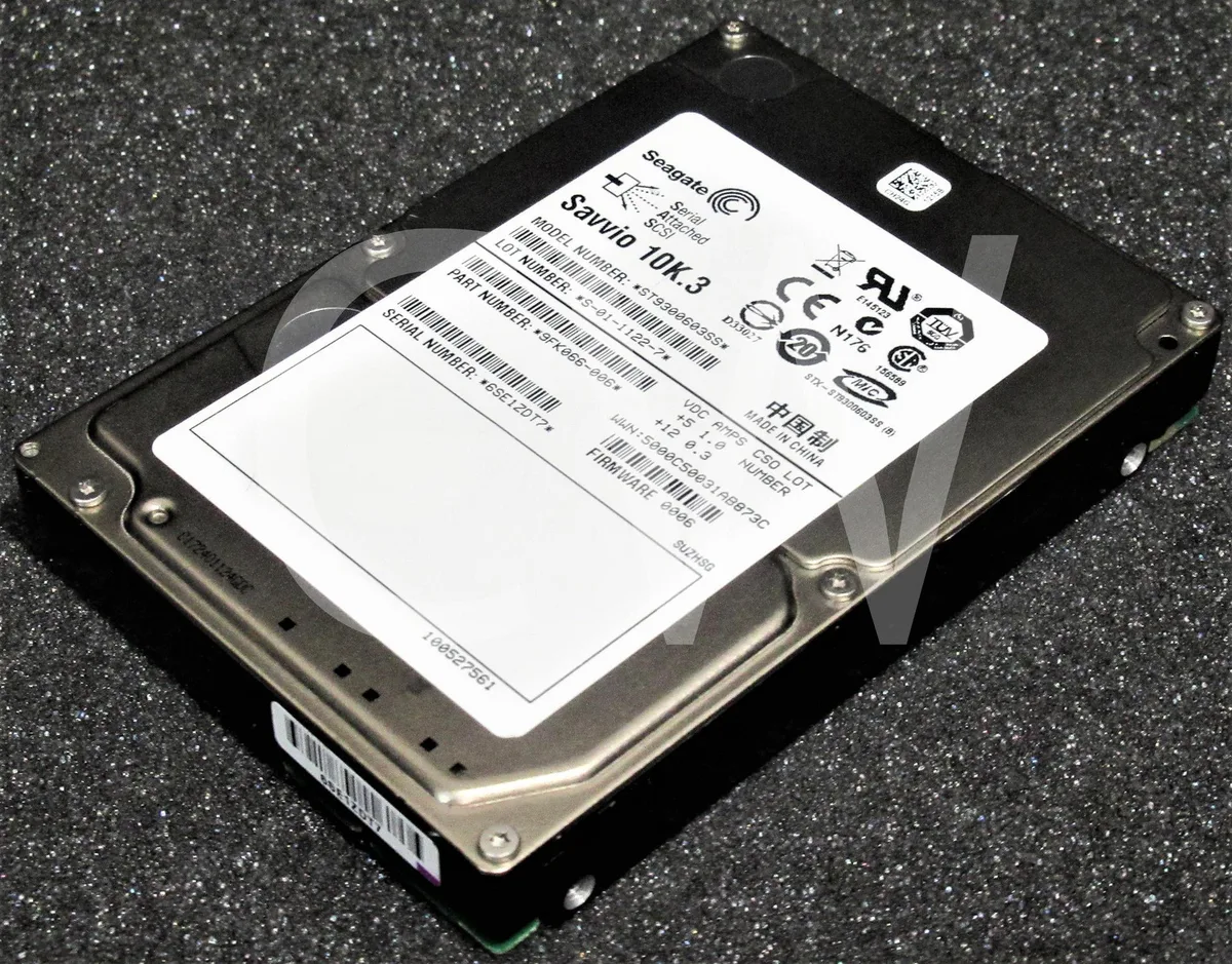 Small silver 2.5 inch SAS hard drive with green circuit board visible