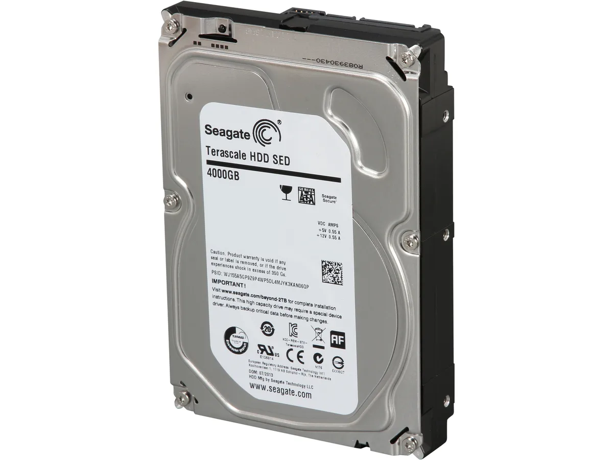 Silver 3.5 inch bare hard drive with green circuit board visible