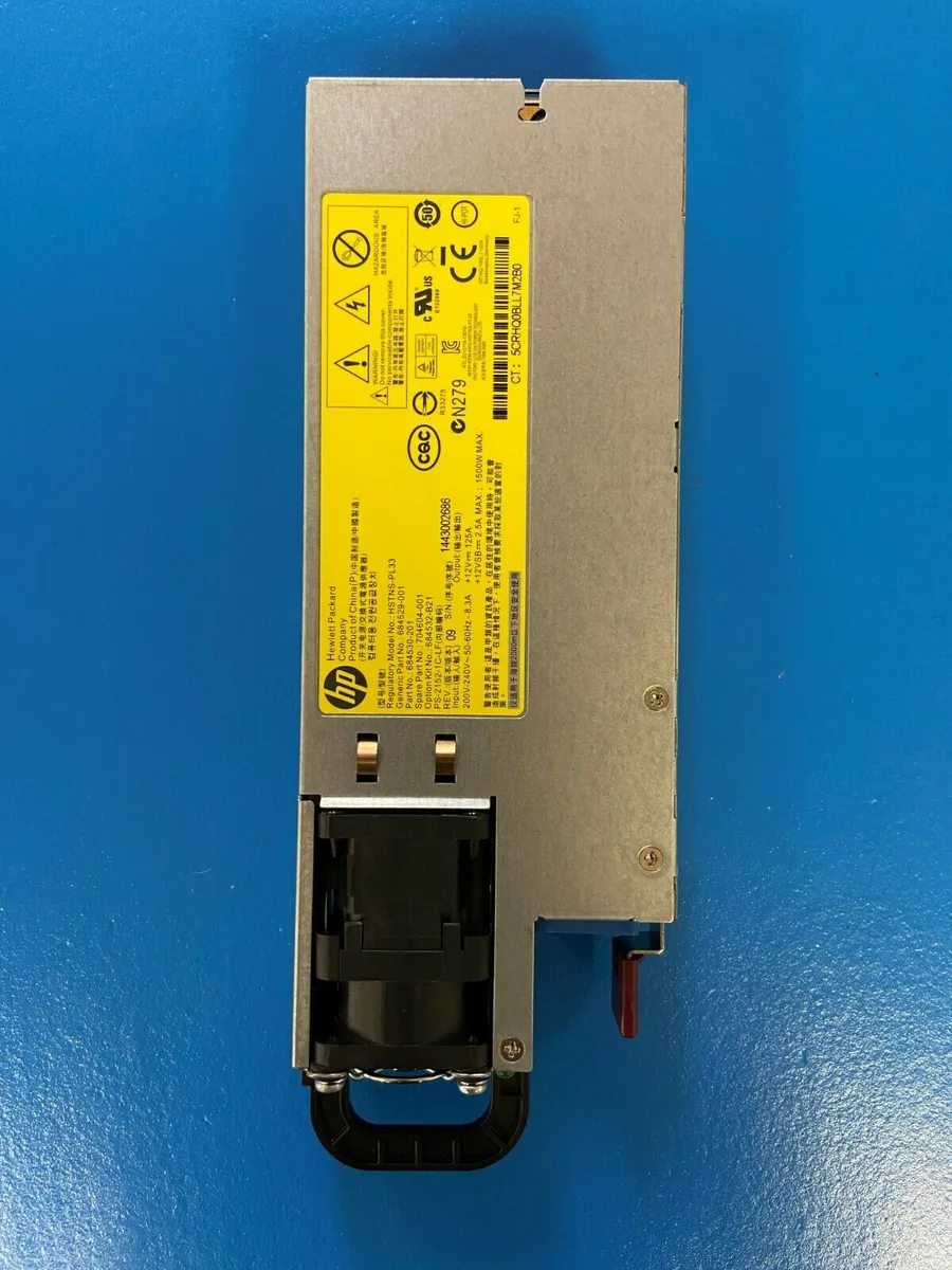 Rectangular silver metal server power supply unit with rear fan grille and hot-plug handle