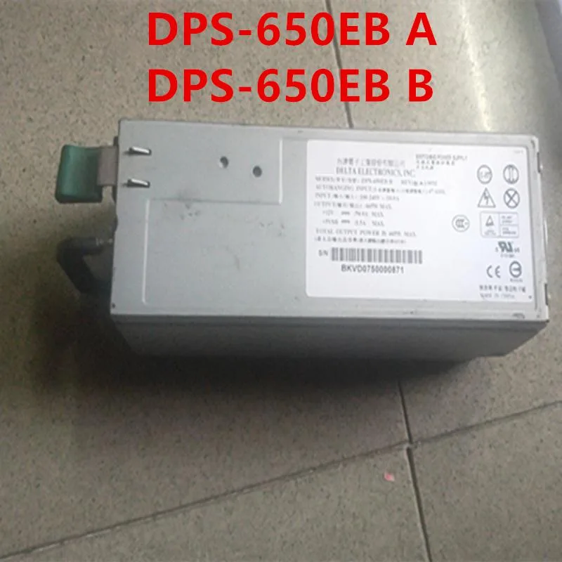 Rectangular metal ATX power supply unit with ventilation grille and label showing model numbers