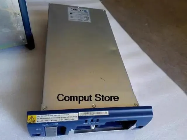 Rectangular metal power supply unit with ventilation slots and connector panel