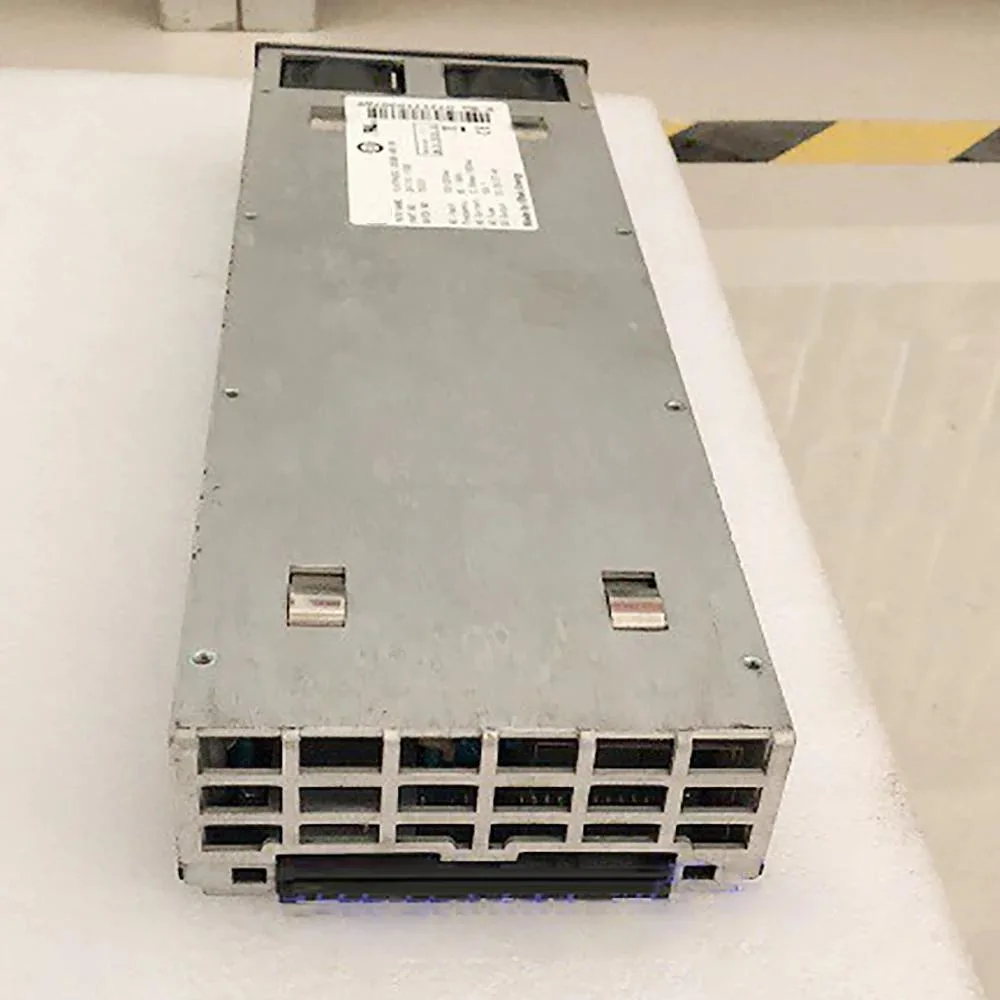 Rectangular silver power supply unit with front label and rear connector panel