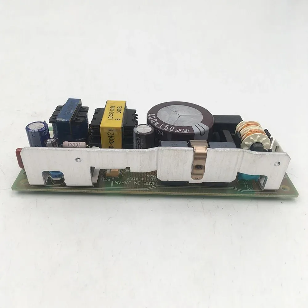 Rectangular black ATX power supply unit with label showing 12V 2.5A 30W