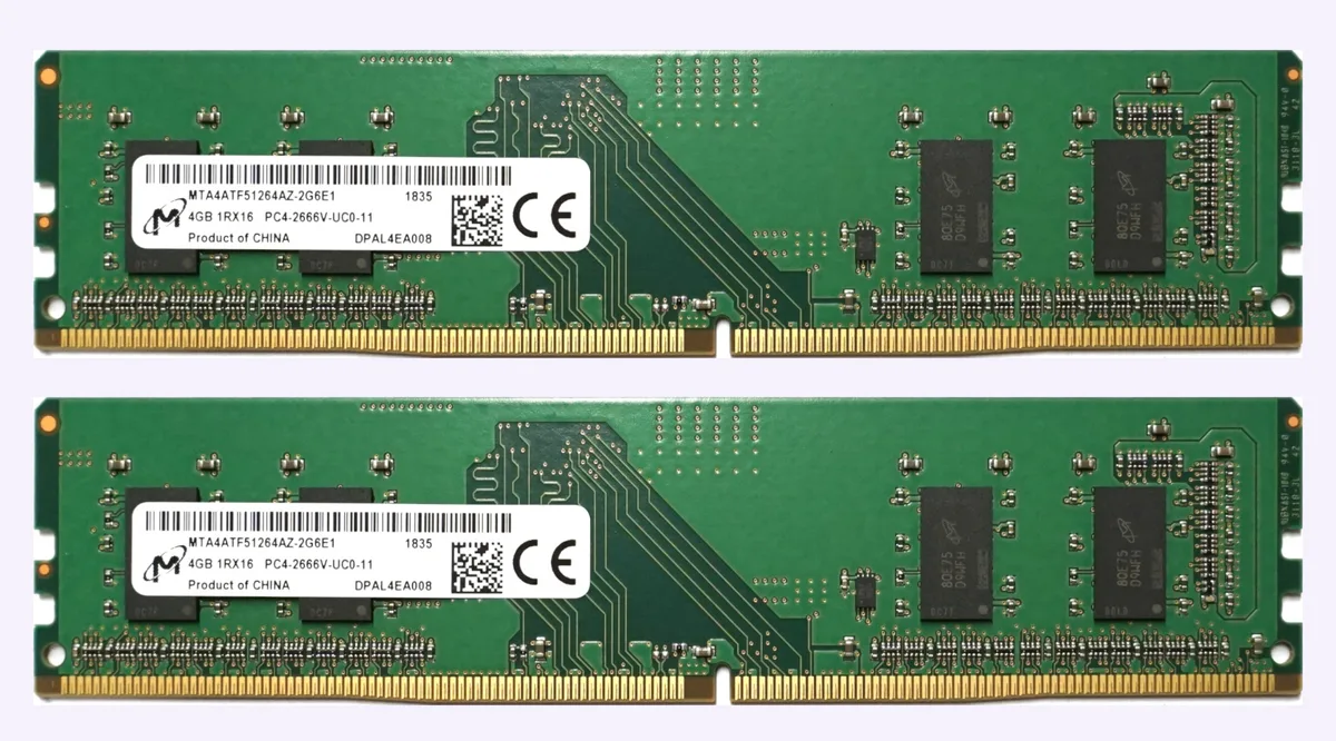 Two green DDR4 UDIMM sticks with black chips and gold contacts