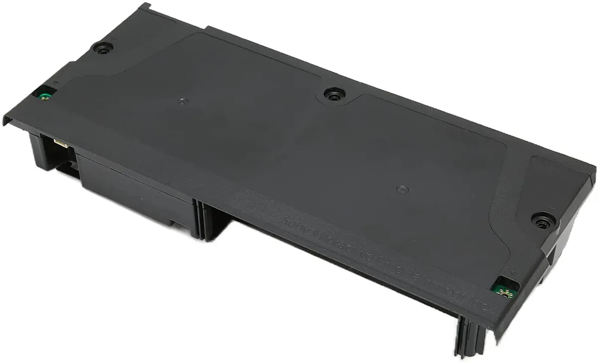 Black rectangular AT power supply unit with sealed casing and attached power cord
