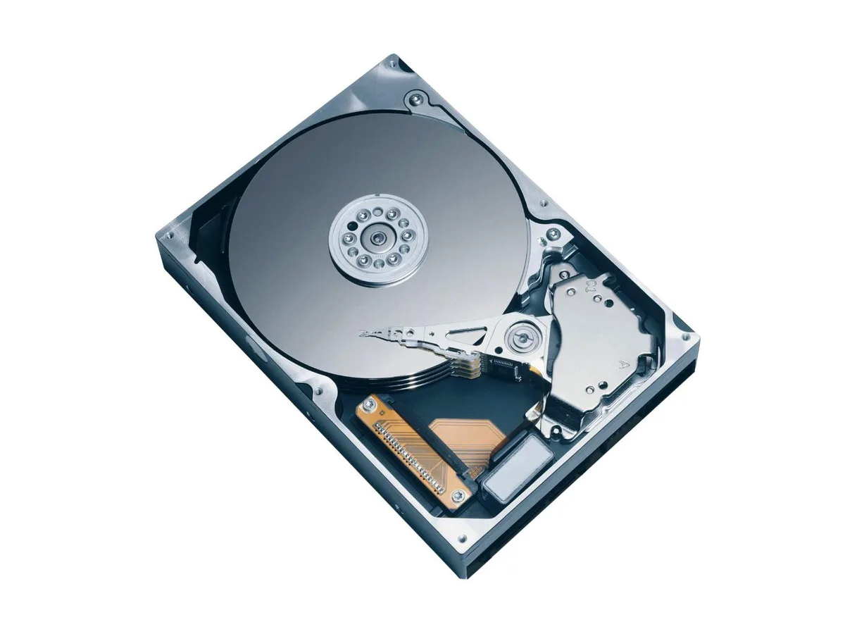Silver 3.5 inch bare hard drive with green circuit board visible