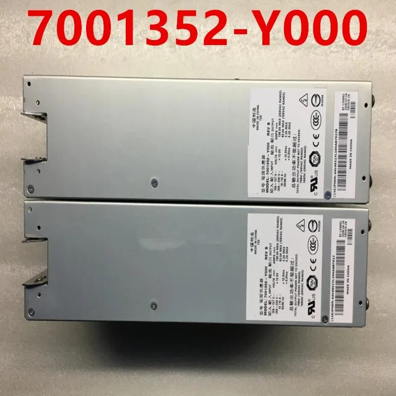 Rectangular ATX power supply unit, matte metal finish, cooling fan visible, power connectors on rear