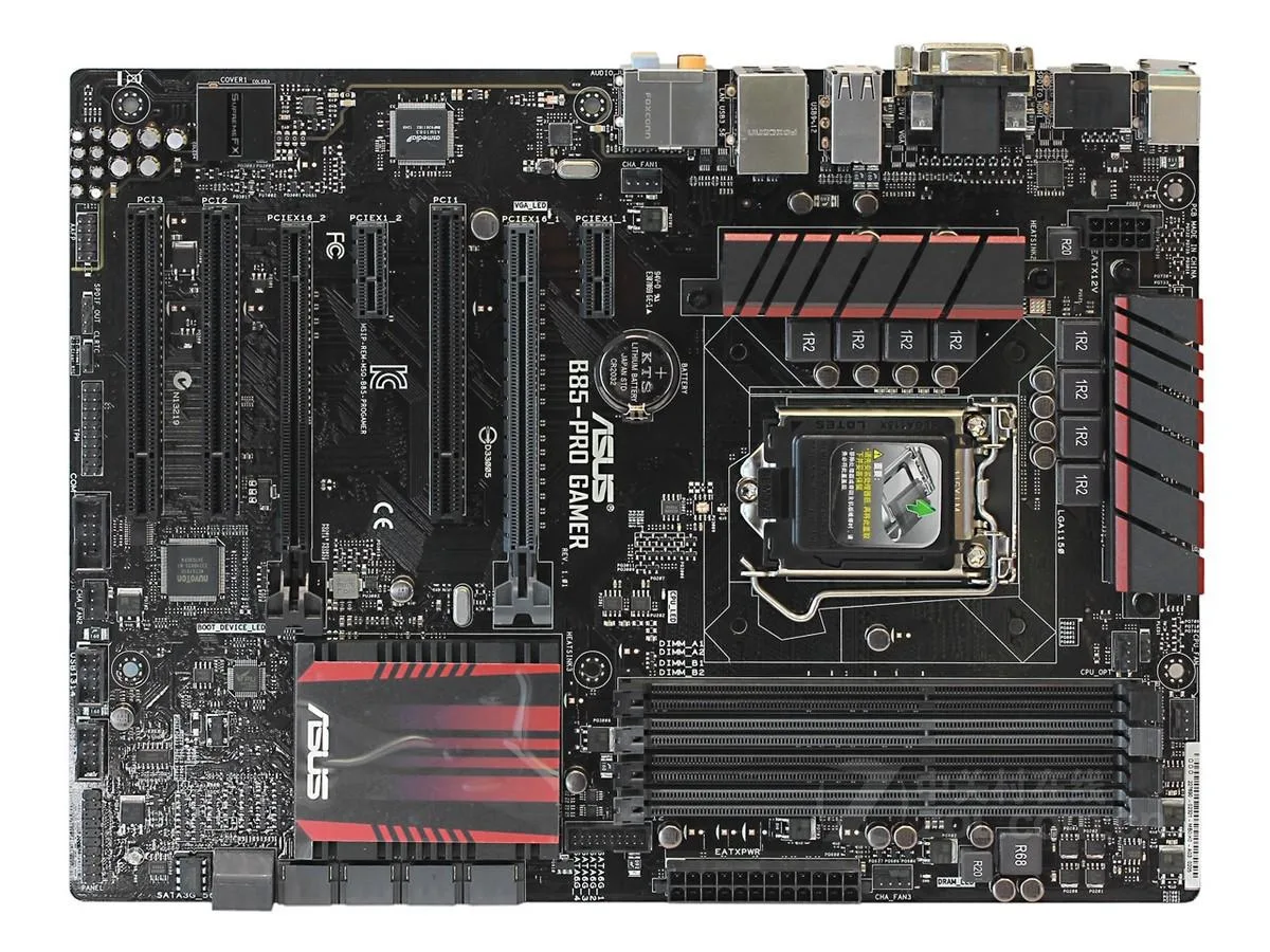 ATX motherboard, dark PCB with grey and black expansion slots, metallic heatsinks, rear I/O panel visible