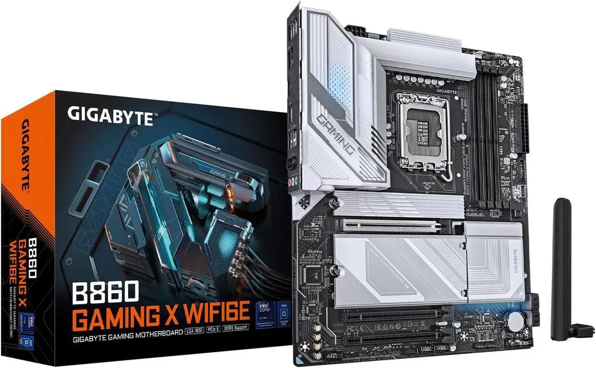 ATX motherboard with black PCB, silver heatsinks and rear I/O shield