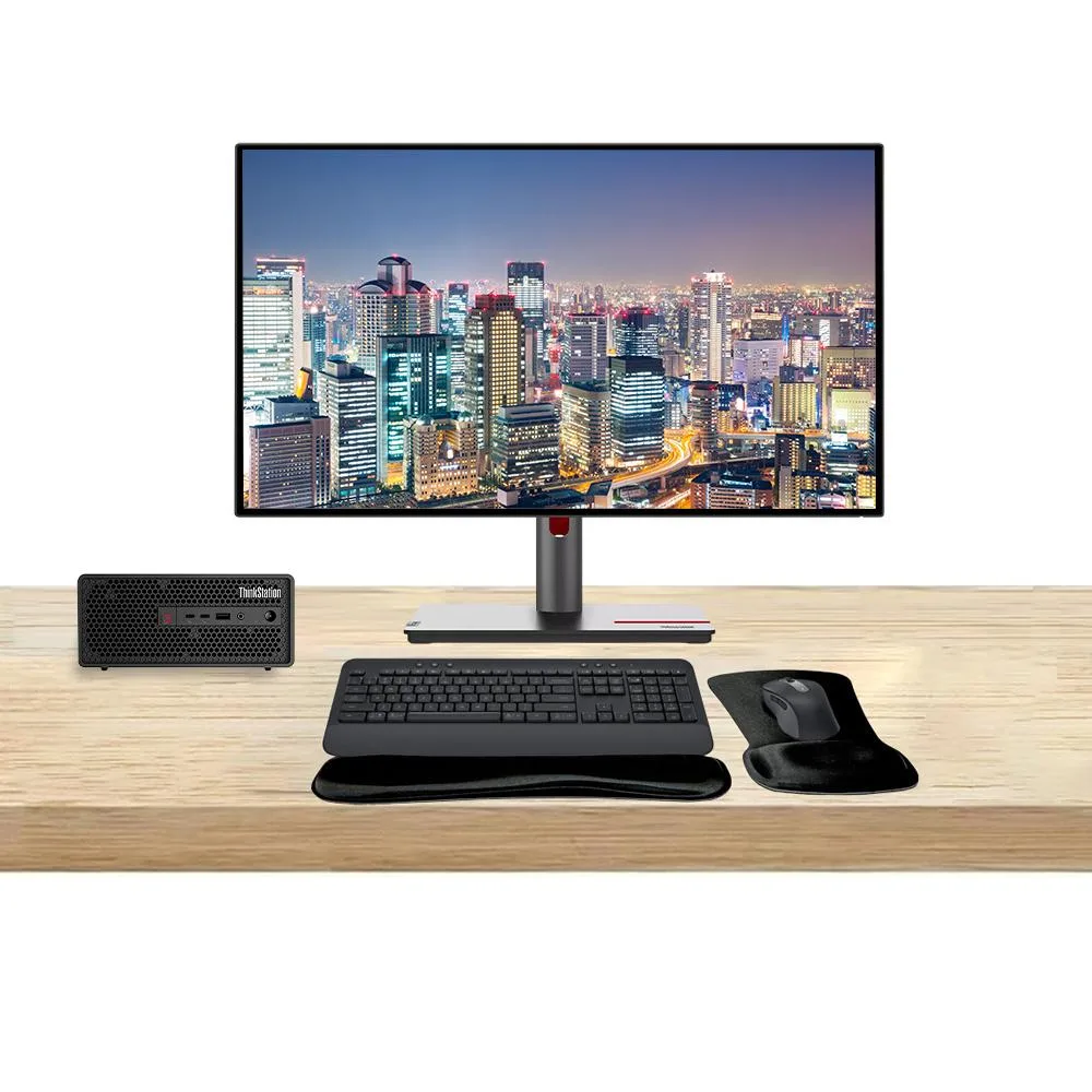 Compact silver SFF tower with two 27-inch QHD monitors, wireless keyboard and mouse