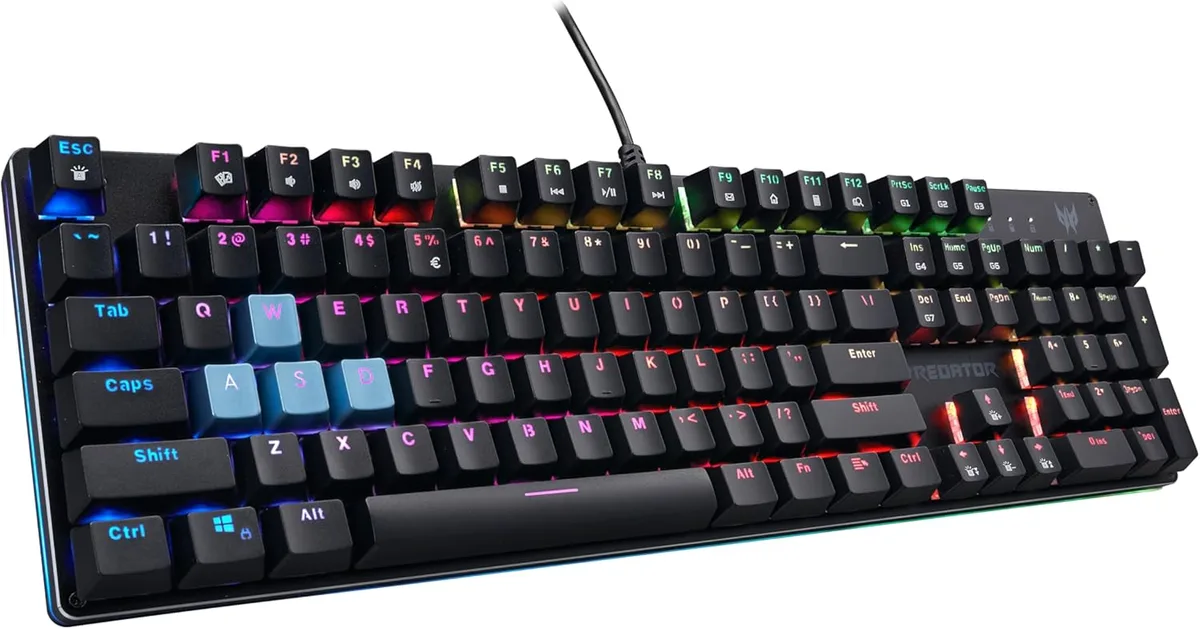 Full-size black mechanical keyboard with RGB backlighting, aluminium top plate, clicky blue switches, no palm rest